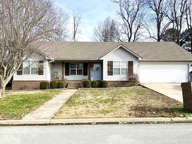 ranch-style home with a front yard and a garage