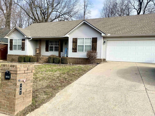 ranch-style house featuring a garage