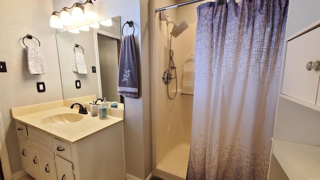 bathroom featuring vanity and walk in shower