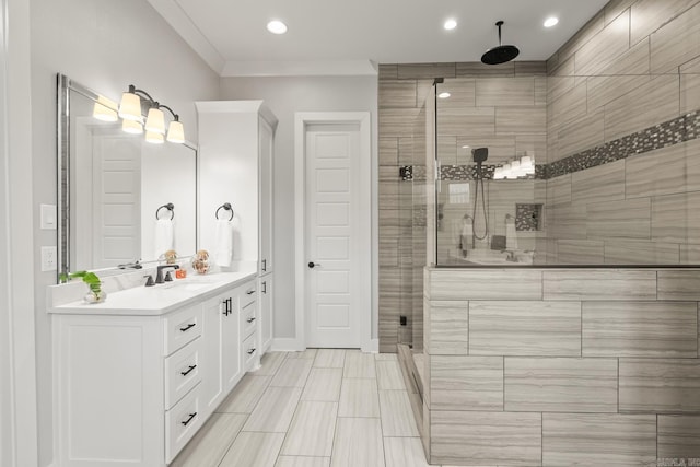 bathroom featuring vanity, an enclosed shower, and crown molding