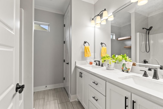 bathroom featuring vanity, crown molding, and walk in shower