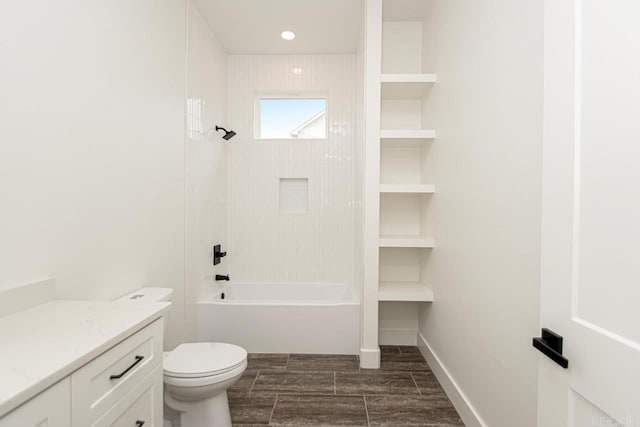 full bathroom with vanity, toilet, and tiled shower / bath