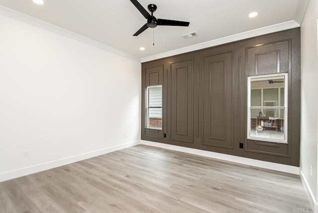 spare room with ceiling fan, light hardwood / wood-style floors, and ornamental molding