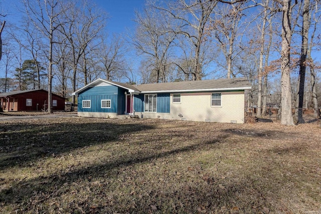 ranch-style house with a front lawn