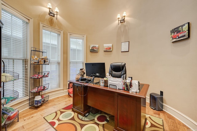 office space with light wood-type flooring