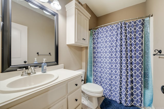 bathroom with vanity, curtained shower, and toilet