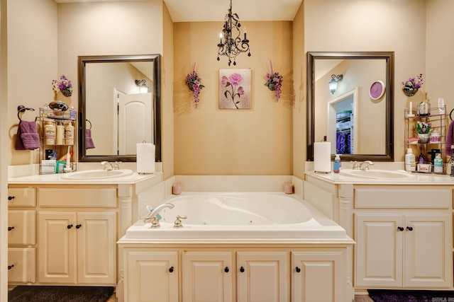 bathroom with vanity and a bath