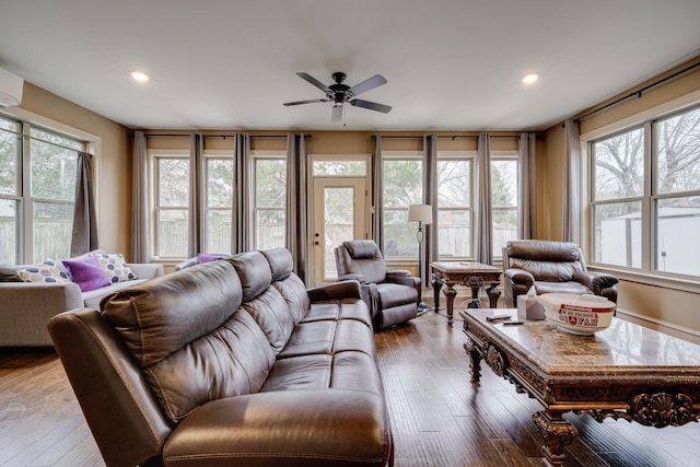 living room with light wood-type flooring and ceiling fan