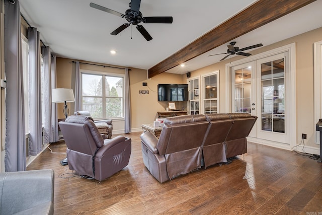 living room with beam ceiling, hardwood / wood-style flooring, french doors, and ceiling fan