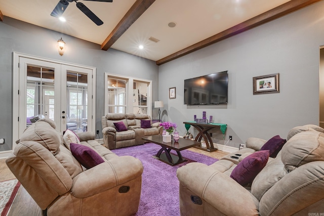 living room featuring beamed ceiling, ceiling fan, hardwood / wood-style floors, and french doors