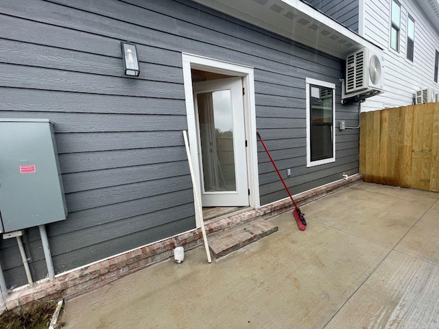 view of side of home featuring ac unit and a patio area