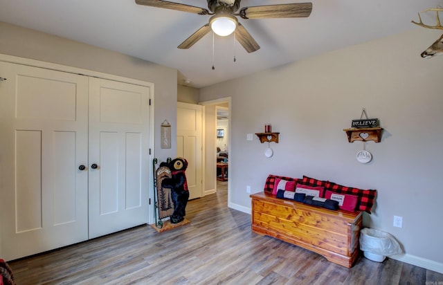 interior space with ceiling fan and hardwood / wood-style flooring