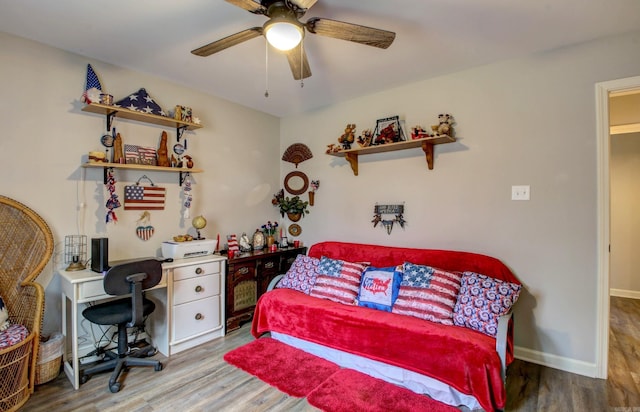 bedroom with ceiling fan and wood-type flooring