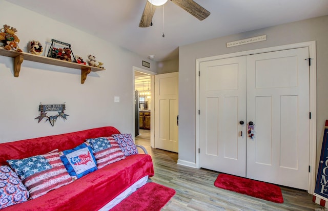 interior space featuring ceiling fan and light hardwood / wood-style flooring