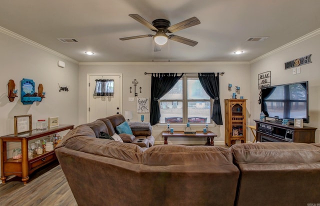 living room featuring ceiling fan, light hardwood / wood-style floors, and ornamental molding