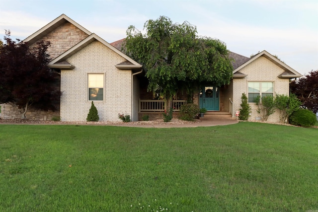 craftsman inspired home with a front lawn