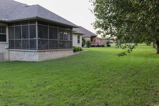 view of yard featuring a sunroom