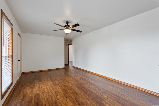 interior space featuring dark wood-type flooring and ceiling fan