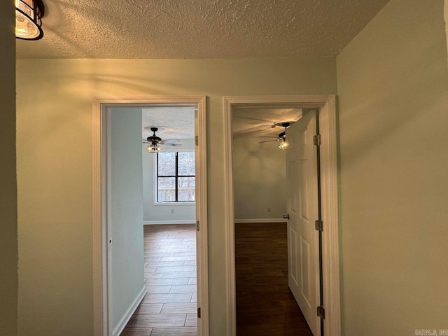 corridor with a textured ceiling