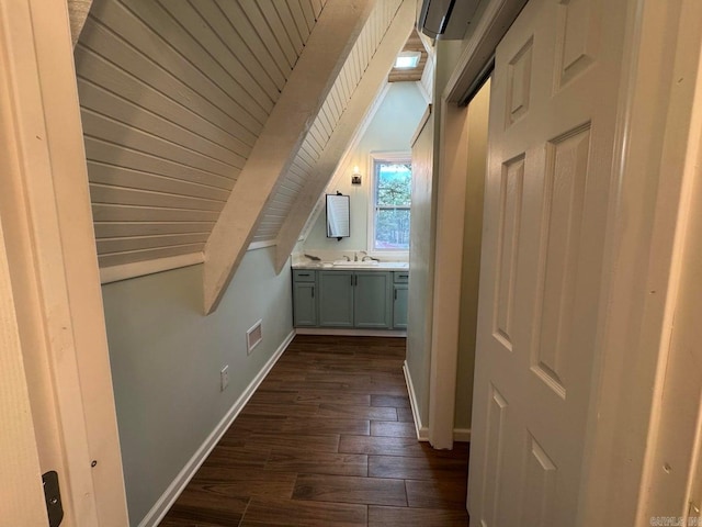 bonus room with vaulted ceiling with beams, wood ceiling, dark wood-type flooring, and sink