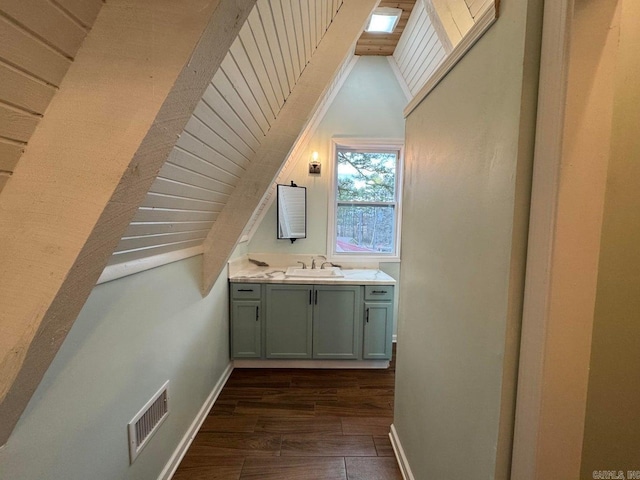 bathroom with vanity and wood-type flooring