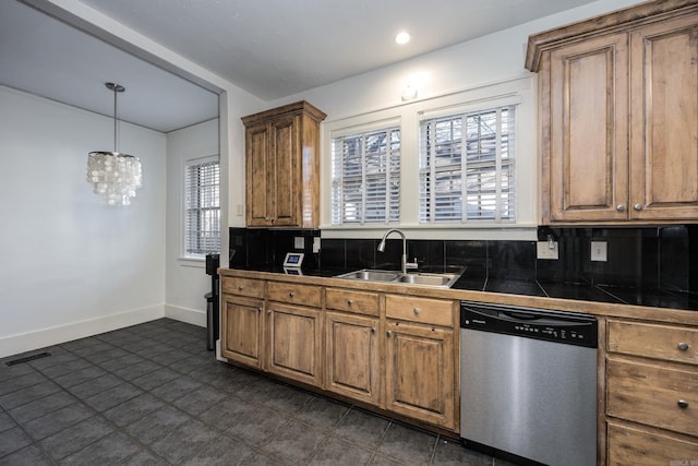 kitchen featuring dishwasher, tile counters, sink, a notable chandelier, and decorative backsplash