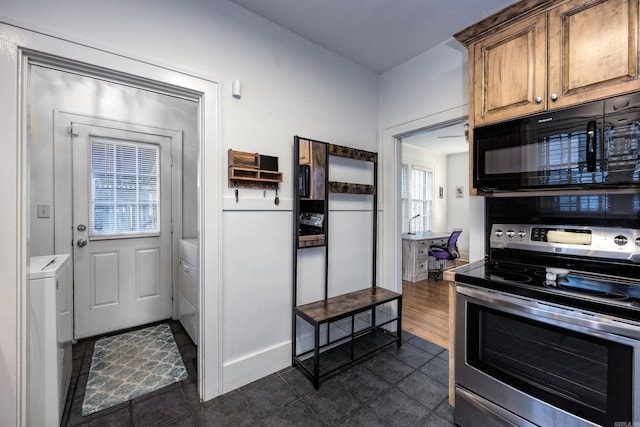 kitchen with separate washer and dryer and stainless steel electric range