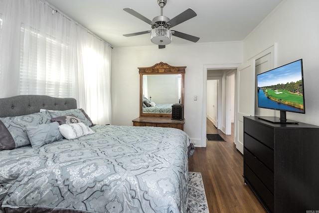 bedroom featuring dark hardwood / wood-style flooring and ceiling fan