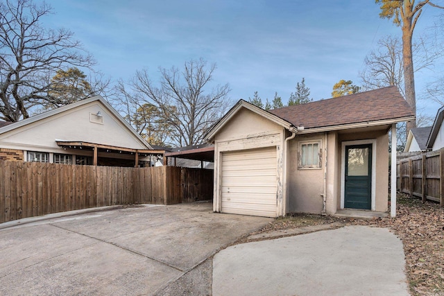 garage featuring a carport