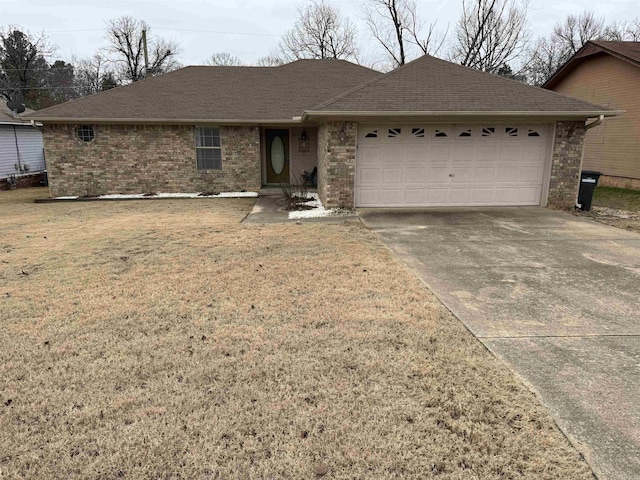 single story home featuring a front lawn and a garage