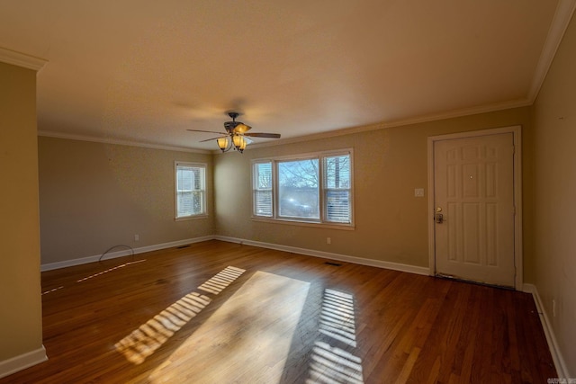 empty room with hardwood / wood-style floors, ceiling fan, and ornamental molding