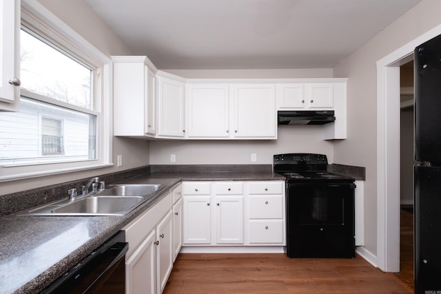 kitchen featuring white cabinetry, sink, black appliances, and dark hardwood / wood-style floors