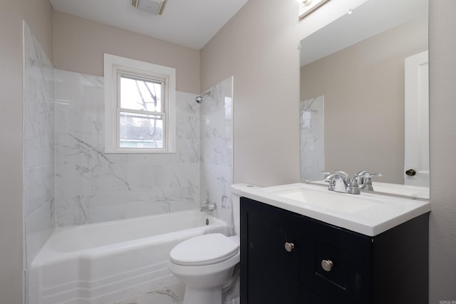 full bathroom with vanity, tiled shower / bath combo, and toilet