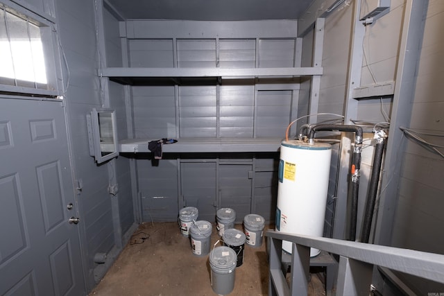 utility room featuring gas water heater