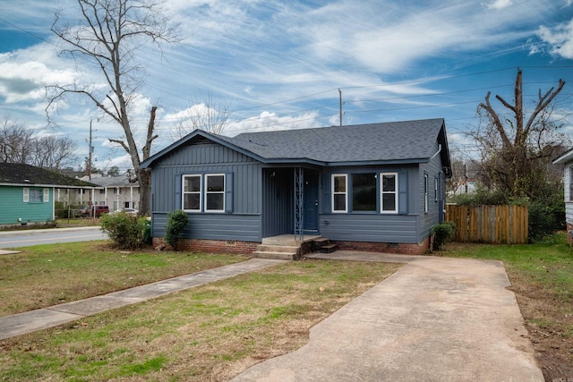 bungalow with a front lawn