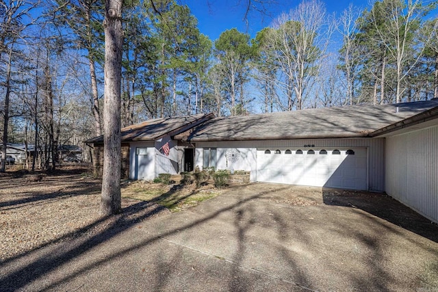 ranch-style house featuring a garage