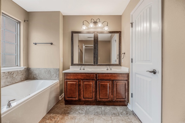 bathroom featuring a bathing tub and vanity