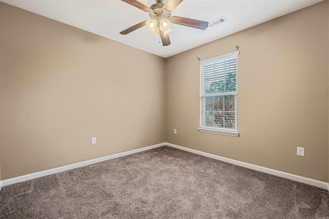 carpeted empty room featuring ceiling fan