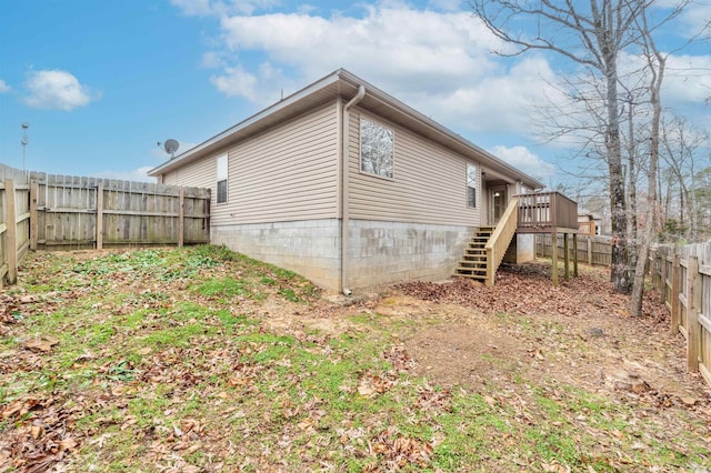 view of side of property featuring a deck