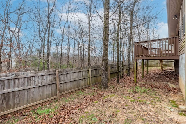 view of yard with a wooden deck