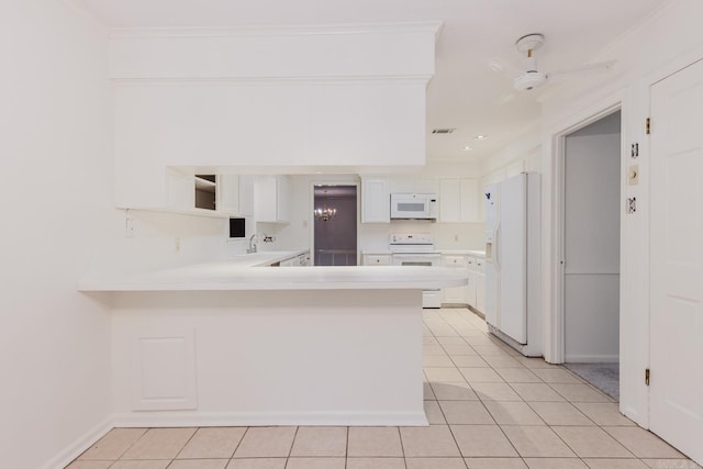 kitchen featuring white cabinets, kitchen peninsula, white appliances, light tile patterned floors, and ornamental molding