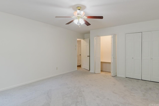 unfurnished bedroom with light carpet and ceiling fan