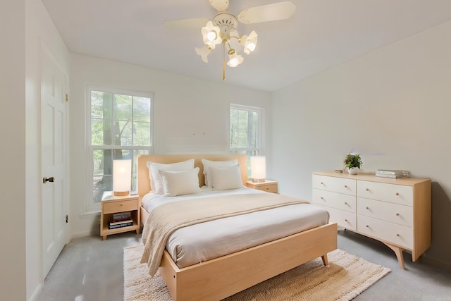 bedroom with ceiling fan and carpet floors