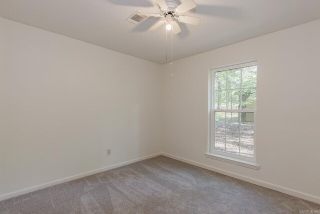 spare room with carpet flooring and ceiling fan