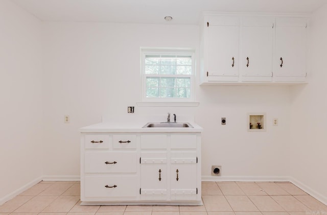 laundry room with sink, cabinets, washer hookup, hookup for an electric dryer, and light tile patterned floors