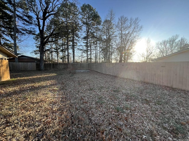 view of yard at dusk