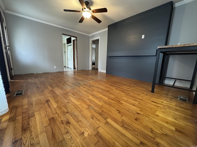 unfurnished room featuring ceiling fan, ornamental molding, and light hardwood / wood-style flooring