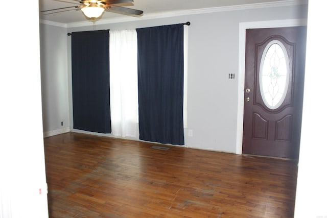 entrance foyer with dark hardwood / wood-style floors, ceiling fan, and crown molding