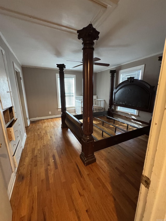 unfurnished bedroom with hardwood / wood-style flooring and ornamental molding