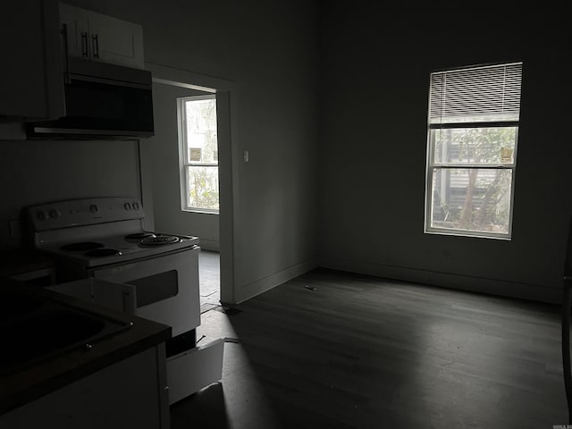 kitchen with white cabinets, white electric range, dark hardwood / wood-style flooring, and sink